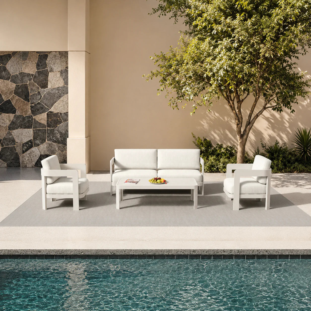 Sofia 4 seater outdoor lounge set shown in a garden setting with sofa, chairs and coffee table solid furniture uk