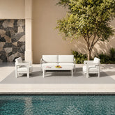 Sofia 4 seater outdoor lounge set shown in a garden setting with sofa, chairs and coffee table solid furniture uk