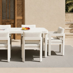 Close-up view of Sofia dining chair showing luxury cushioned seat and woven fabric texture solid furniture uk