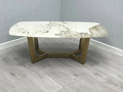 Sorrento oval coffee table with cream and gold ceramic top and gold frame main view | Solid Furniture UK