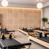 Square straight slat acoustic wall panels in oak finish by Solid Furniture UK installed on a modern UK interior feature wall showing full room transformation and acoustic design.