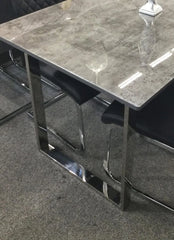Close-up of Tokyo Dining Table grey stone-effect glass surface showing smooth finish and premium texture detail solid furniture UK