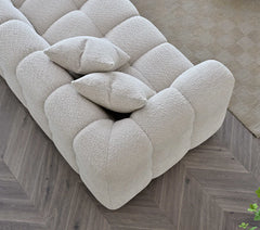 Angled view of Tribeca Sofa Range in oatmeal boucle fabric solid furniture UK