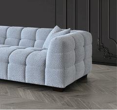 Side corner view of Tribeca sofa in pearl bouclé fabric - SOLID FURNITURE LTD