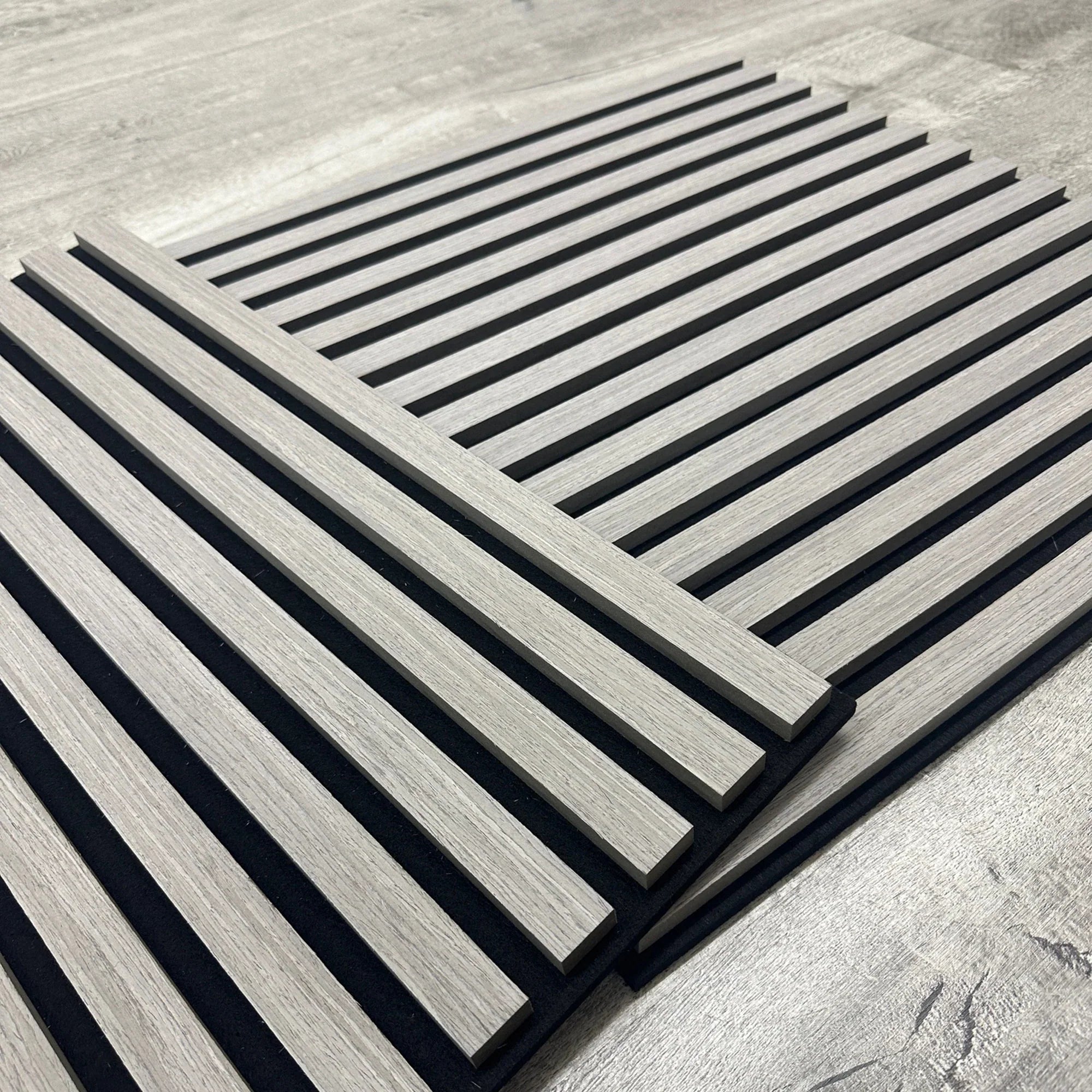 3D decorative angled view of a square ash grey acoustic wall panel by Solid Furniture LTD highlighting slat detail, premium finish, and acoustic performance.