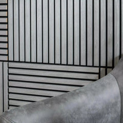3D decorative close-up of a square ash grey acoustic wall panel by Solid Furniture LTD showing wood slat texture, gap spacing, and felt backing for sound absorption