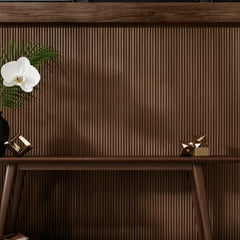 Modern interior with Walnut Flute flexible wood veneer acoustic wall panels installed on wall with soft LED lighting creating a warm, elegant, and sound-enhanced space solid furniture UK