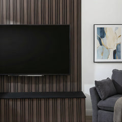 Walnut slatted acoustic wall panel installed in living room with sound-absorbing felt backing solid furniture UK