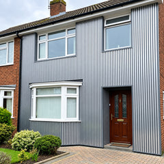 Waterproof chrome and black wood effect slatted WPC wall panels 15x240cm installed on the outside of a house – Solid Furniture UK