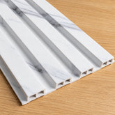 Main view showing the original white and grey marble effect colour of waterproof slatted wall panels 15x240cm by Solid Furniture UK