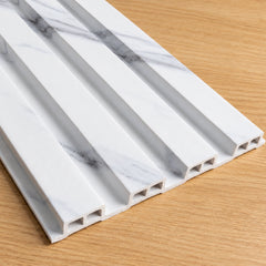Main view showing the original white and grey marble effect colour of waterproof slatted wall panels 15x240cm by Solid Furniture UK