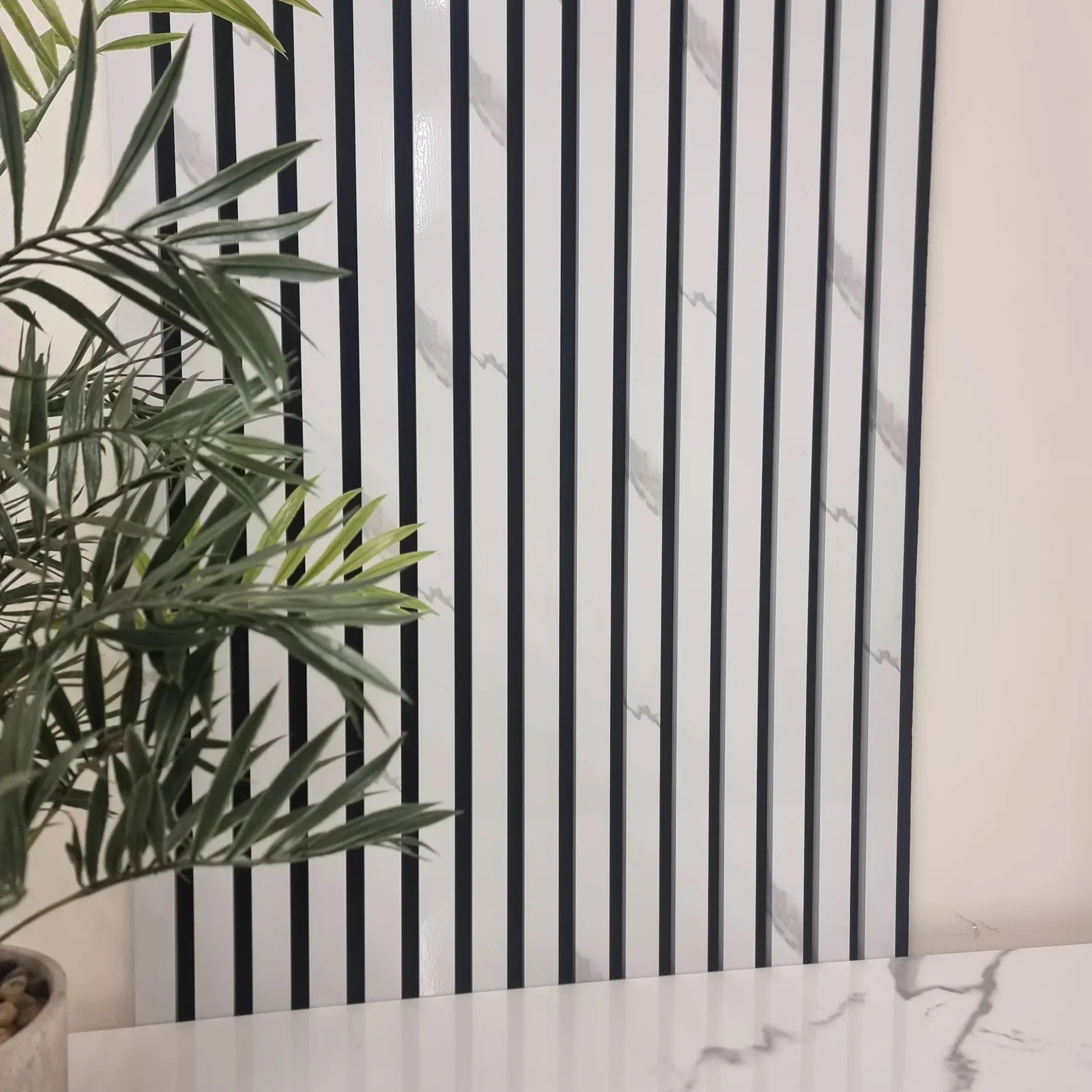 Upgrade your interiors with White Marble Color Slat Wall Panels, perfect for modern homes and offices with solid furniture UK