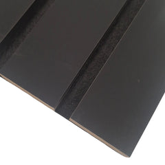 Close-up of wide slat 3-sided black wall panel showing smooth textured finish, bold black color, and acoustic felt backing for a modern, sleek look solid furniture UK