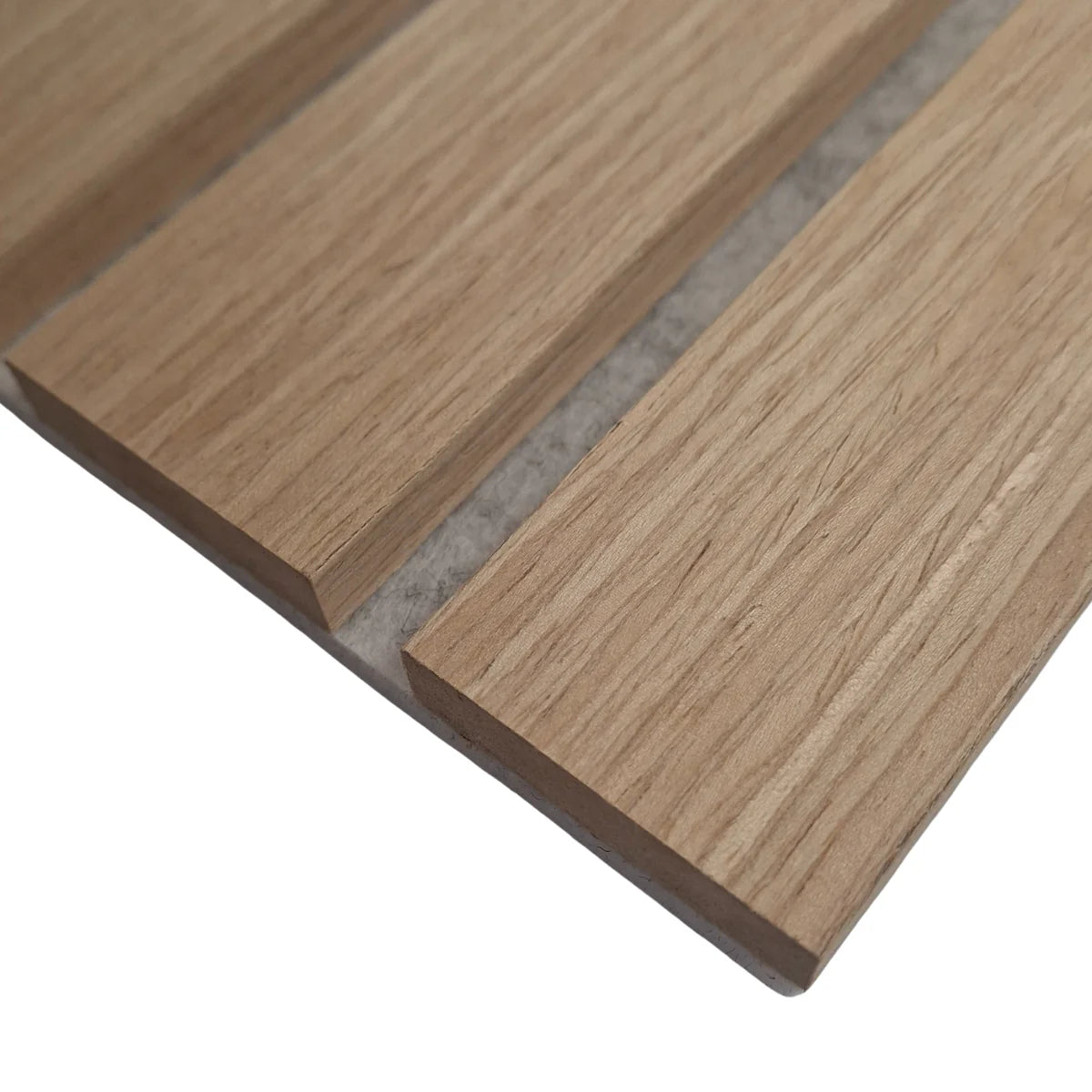 Close-up of wide slat 3-sided wood veneer acoustic wall panel in premium oak on grey felt highlighting texture, smooth finish, and detailed slat profile solid furniture UK