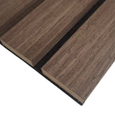 Close-up view of wide slat 3-sided wood veneer acoustic wall panel in premium smoked oak finish highlighting rich grain texture and modern slat detail solid furniture UK