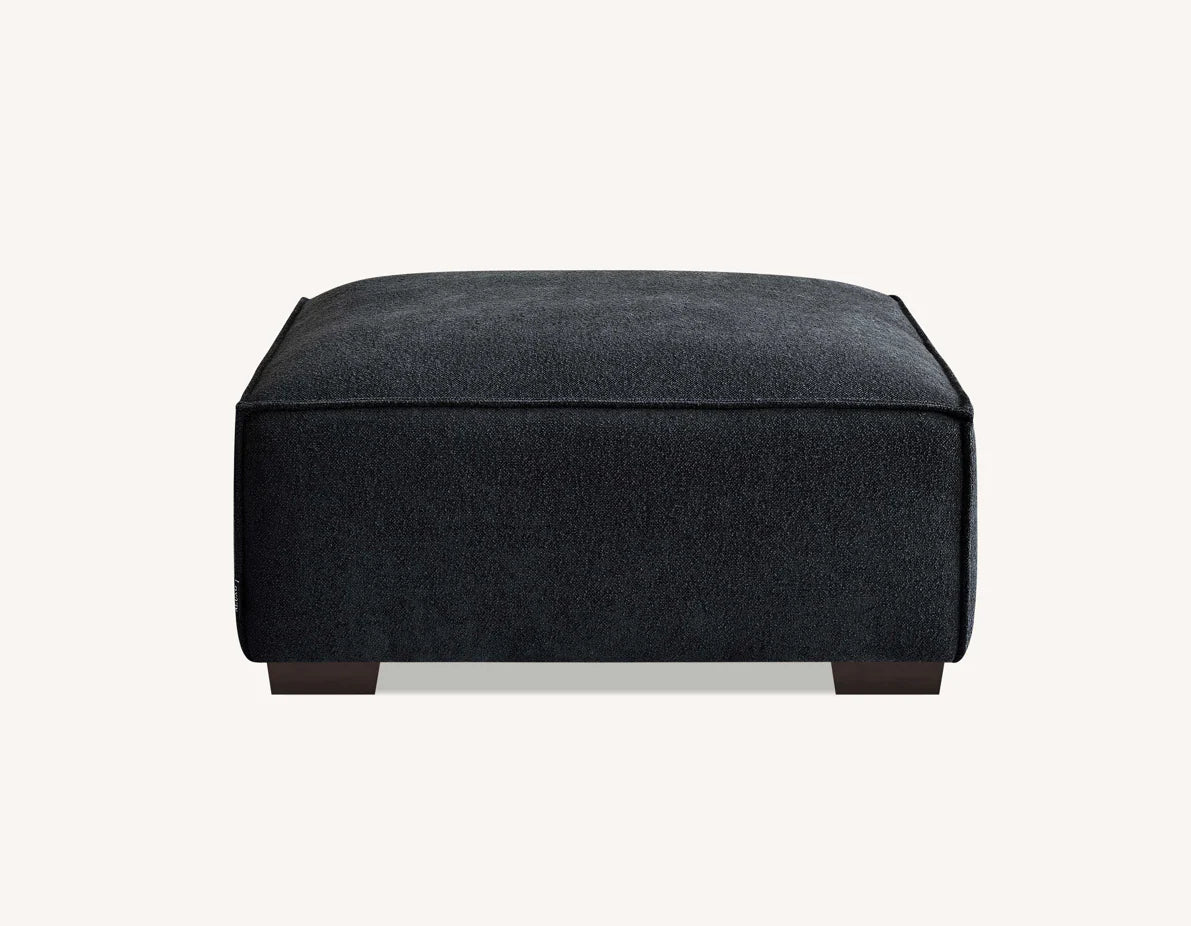 Dakota bouclé footstool with duck feather filling used as chaise extension for modern sofa