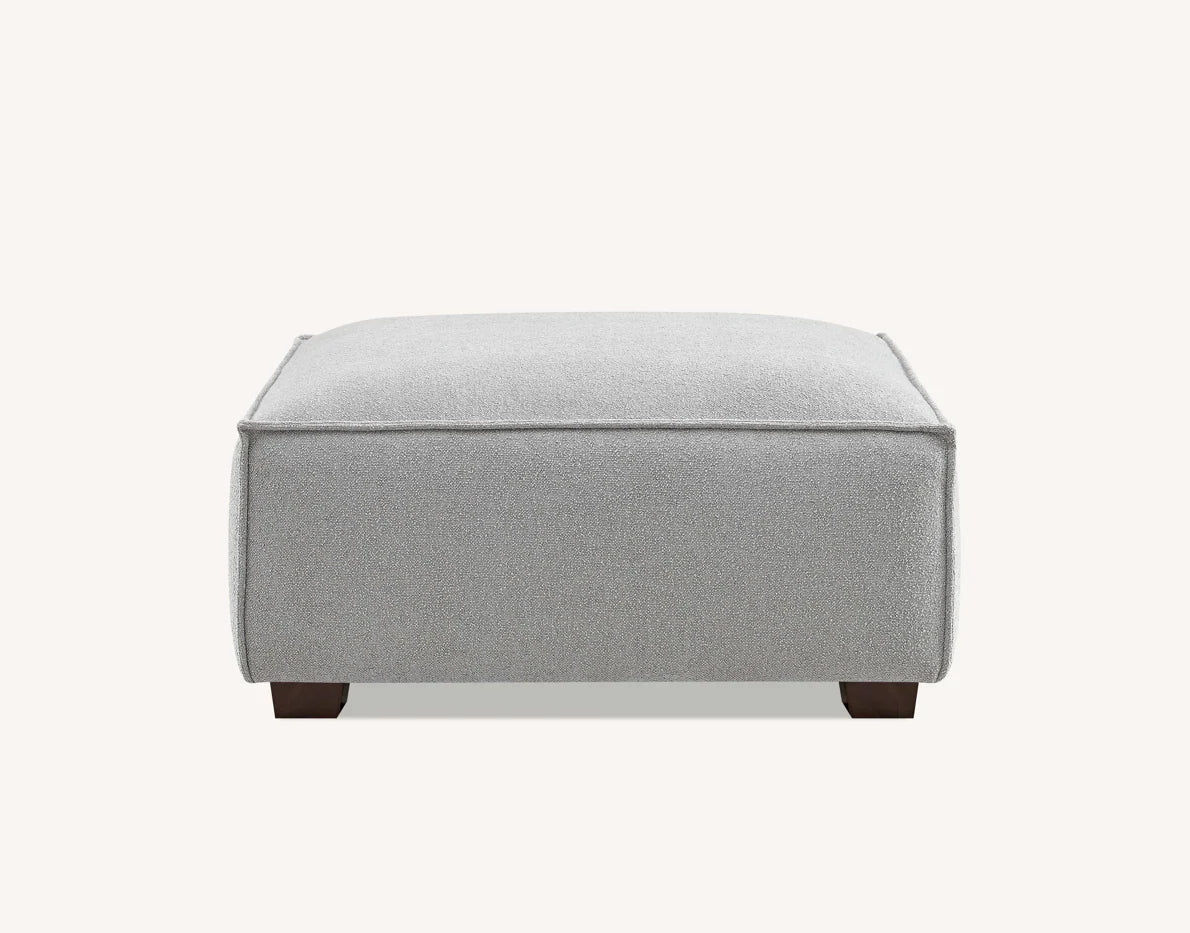 Dakota bouclé footstool with duck feather filling used as chaise extension for modern sofa