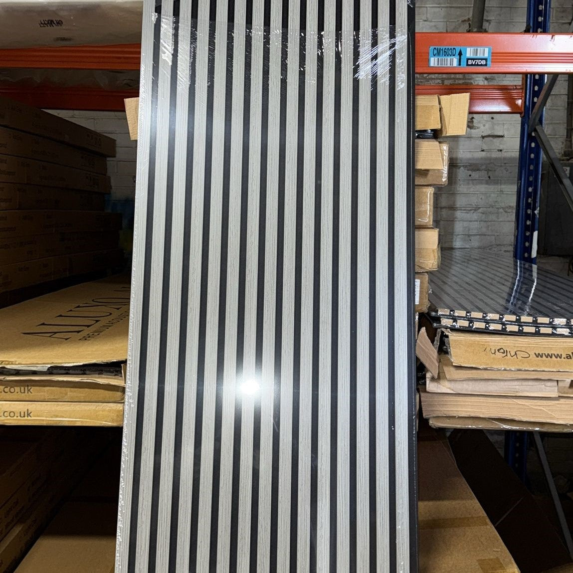 Light Grey Acoustic Slatted Wall Panel 60x240 cm, HDF sound-absorbing, installed in modern home with solid furniture original 