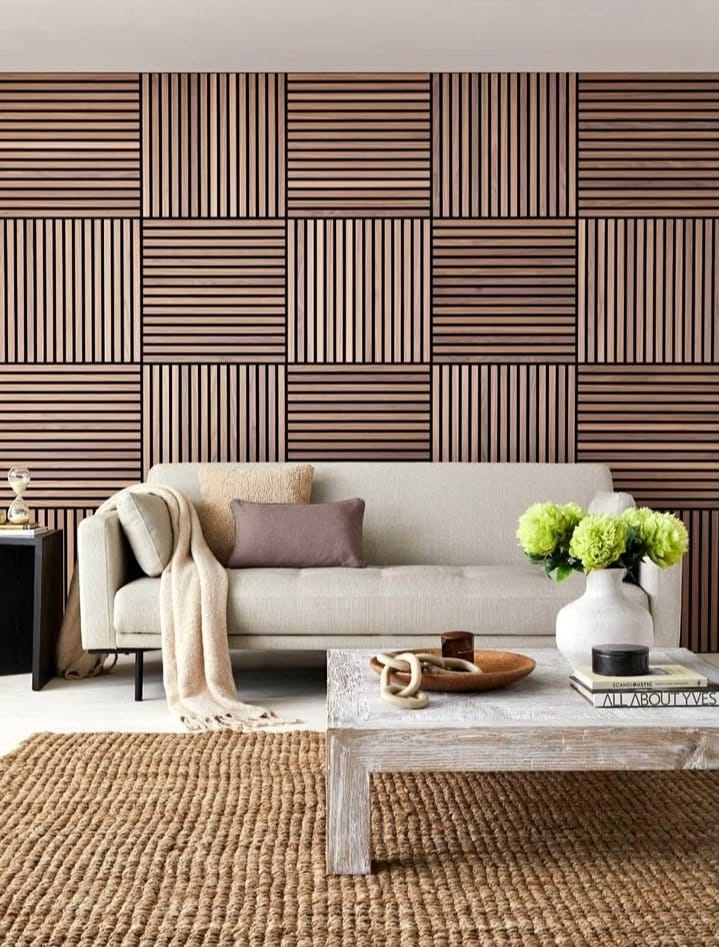 3D decorative light oak acoustic wall panels behind a TV in a lounge area, reducing echo and adding contemporary style.