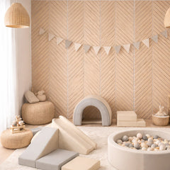 Chevron acoustic wall panels by Solid Furniture UK in oak on grey felt installed on a modern interior feature wall