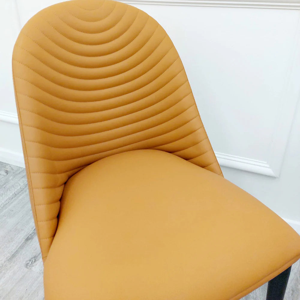 Detailed view of the comfortable tan seat and ribbed stitching design of Alba Dining Chair by Solid Furniture UK