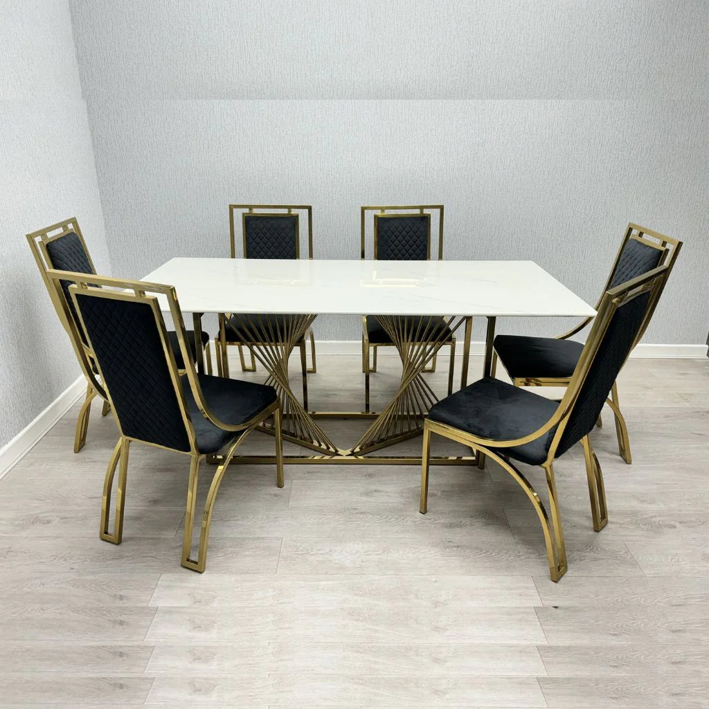 Amelia white ceramic dining table with gold Windsor chairs from Solid Furniture UK in a modern dining room