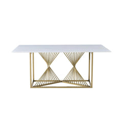 Amelia white ceramic dining table with gold frame from Solid Furniture UK in a stylish dining room