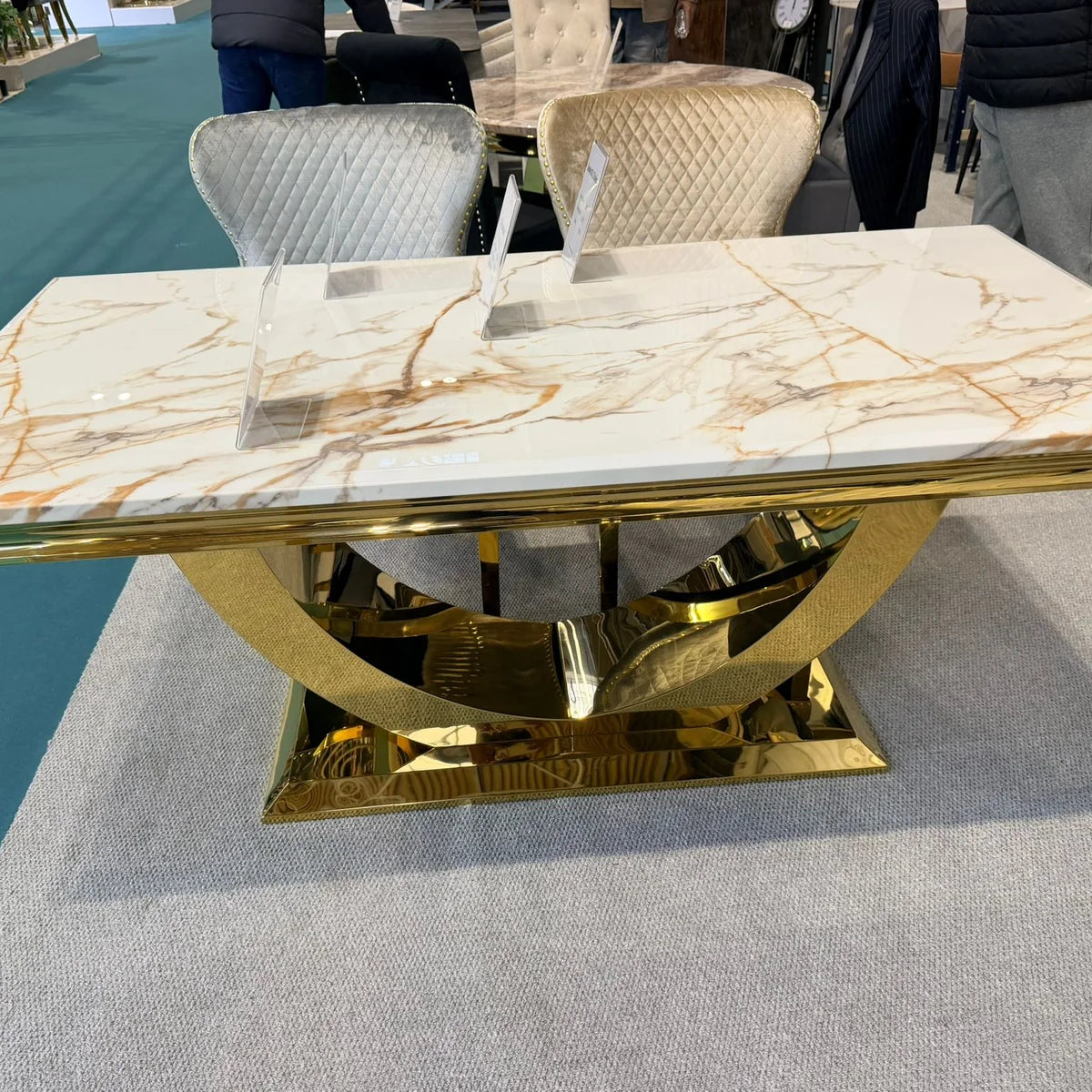 Arial dining table with white marble top and gold base | Solid Furniture UK