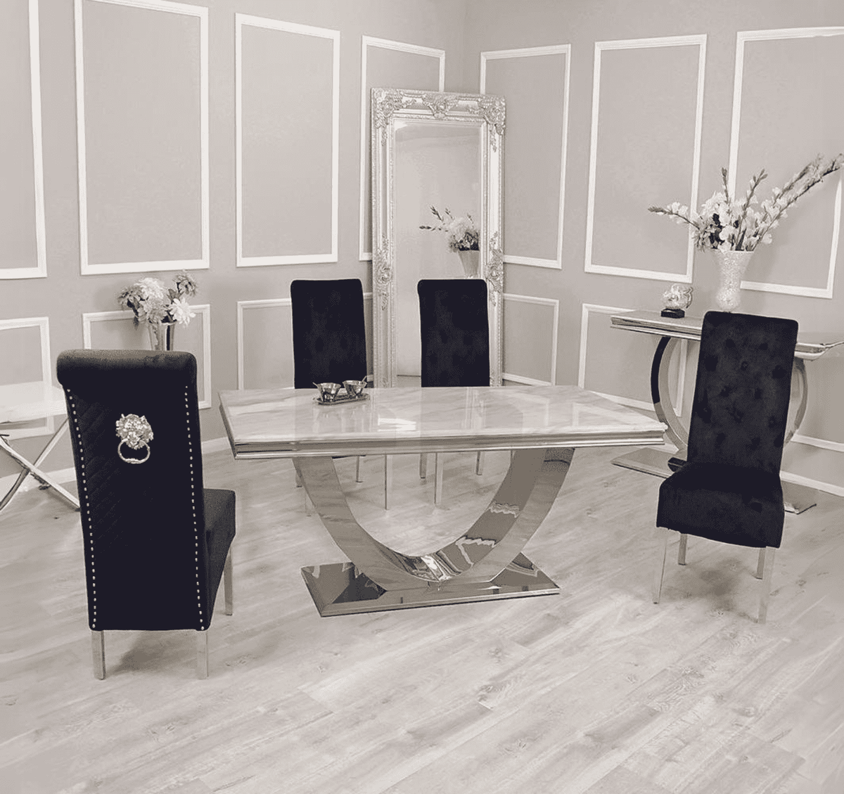 Arial white marble dining table with Sofia black velvet chairs set by Solid Furniture UK in a modern dining room