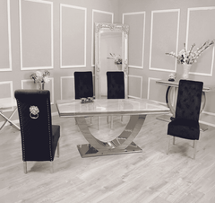 Arial white marble dining table with Sofia black velvet chairs set by Solid Furniture UK in a modern dining room
