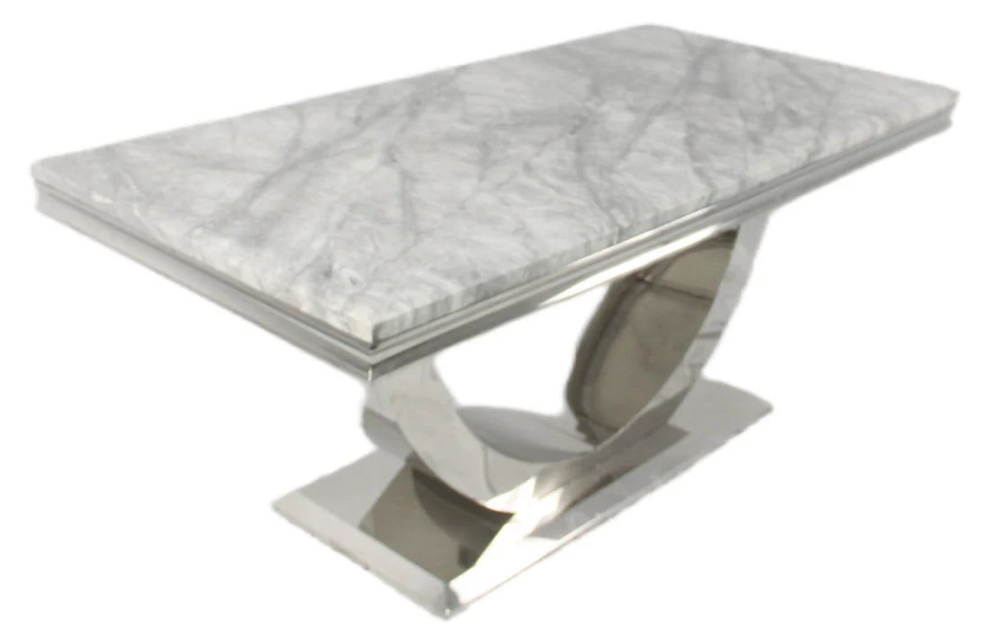 Minimal white marble dining table with a clean and modern aesthetic. solid furniture uk