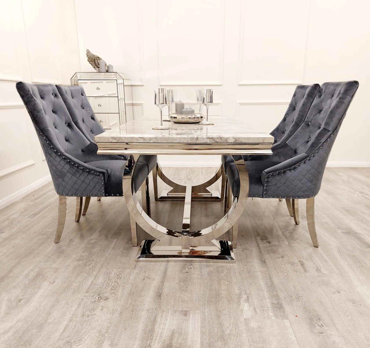 Ariana dining table side angle view with Majestic dark grey chairs modern chrome dining set UK Solid Furniture UK