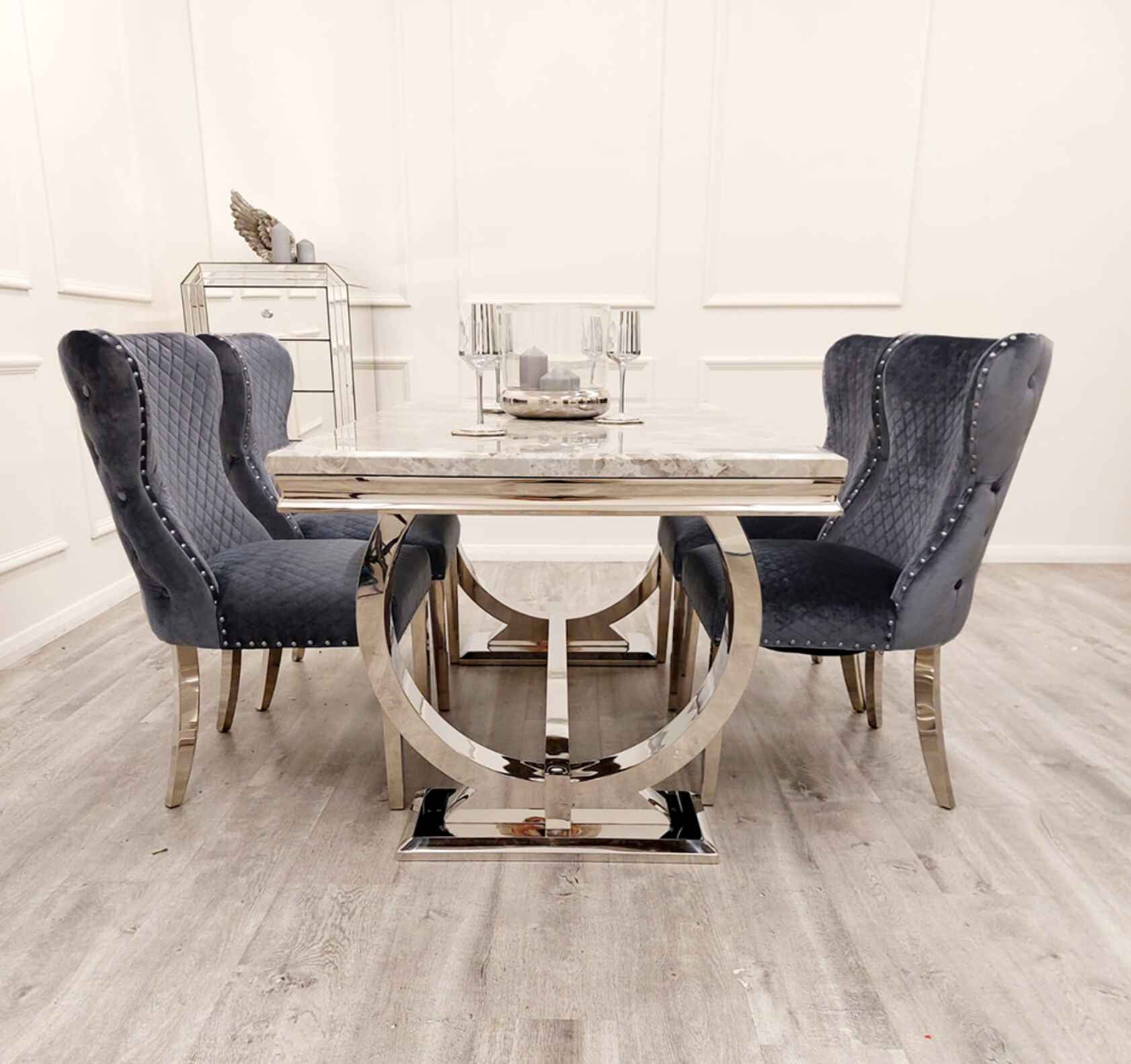 Close up of Ariana marble effect dining table and Valentino velvet chairs Solid Furniture UK