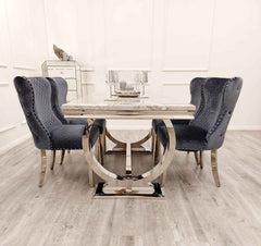 Close up of Ariana marble effect dining table and Valentino velvet chairs Solid Furniture UK