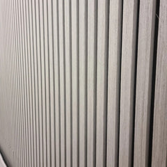 Close-up of real wood ash grey acoustic slat panel