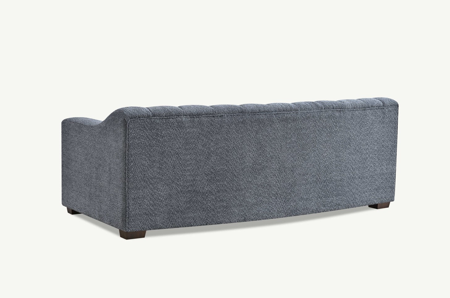 Back view of Astoria 3 seater sofa in iron bouclé showing clean design and textured fabric UK solid furniture UK
