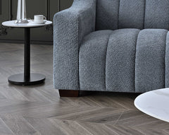 Corner angle view of Astoria 3 seater sofa in iron bouclé showcasing curves and stylish design UK solid furniture UK