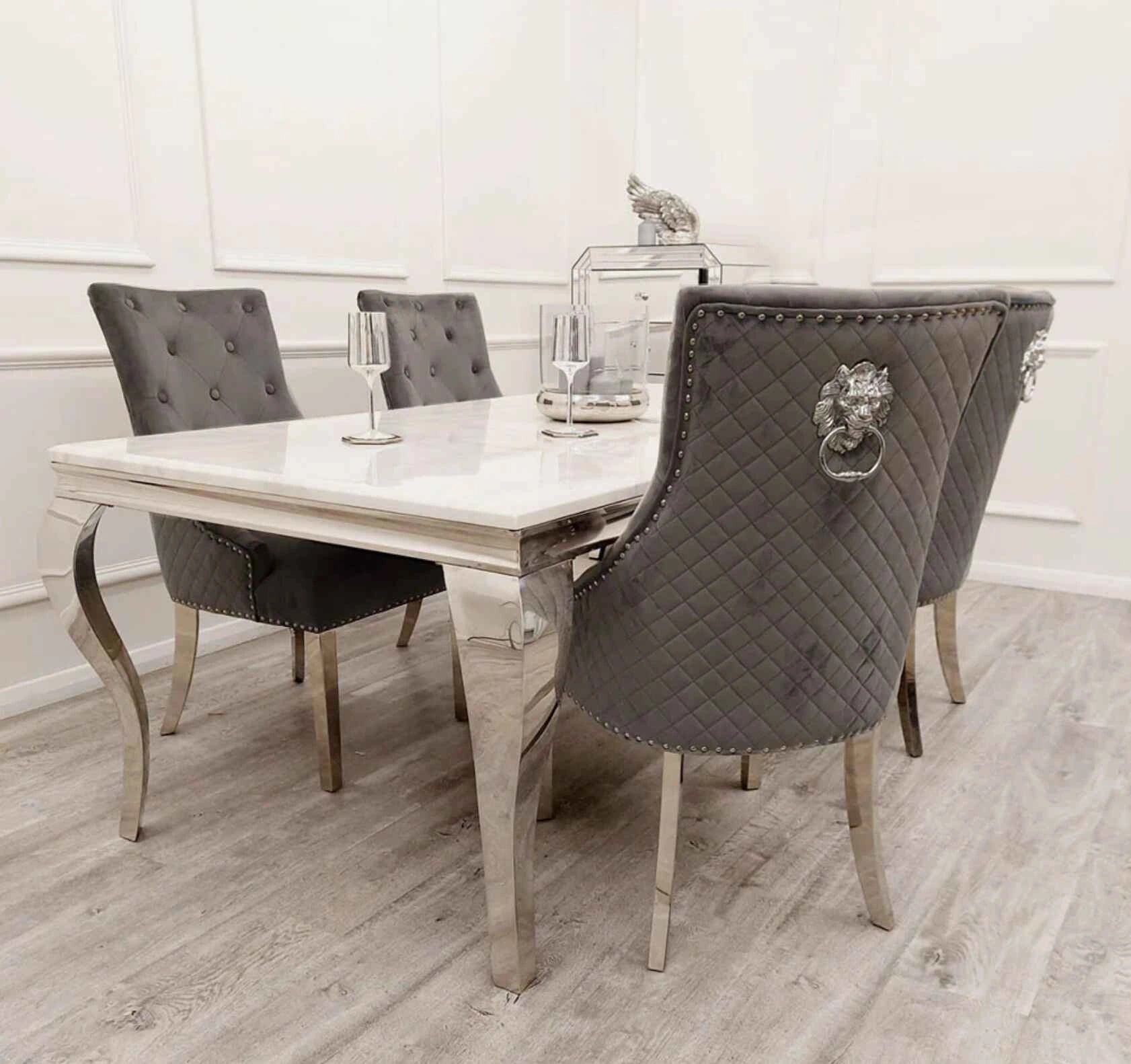 Dark grey Bentley chrome velvet dining chair UK styled with dining table in modern UK dining room setting from Solid Furniture UK