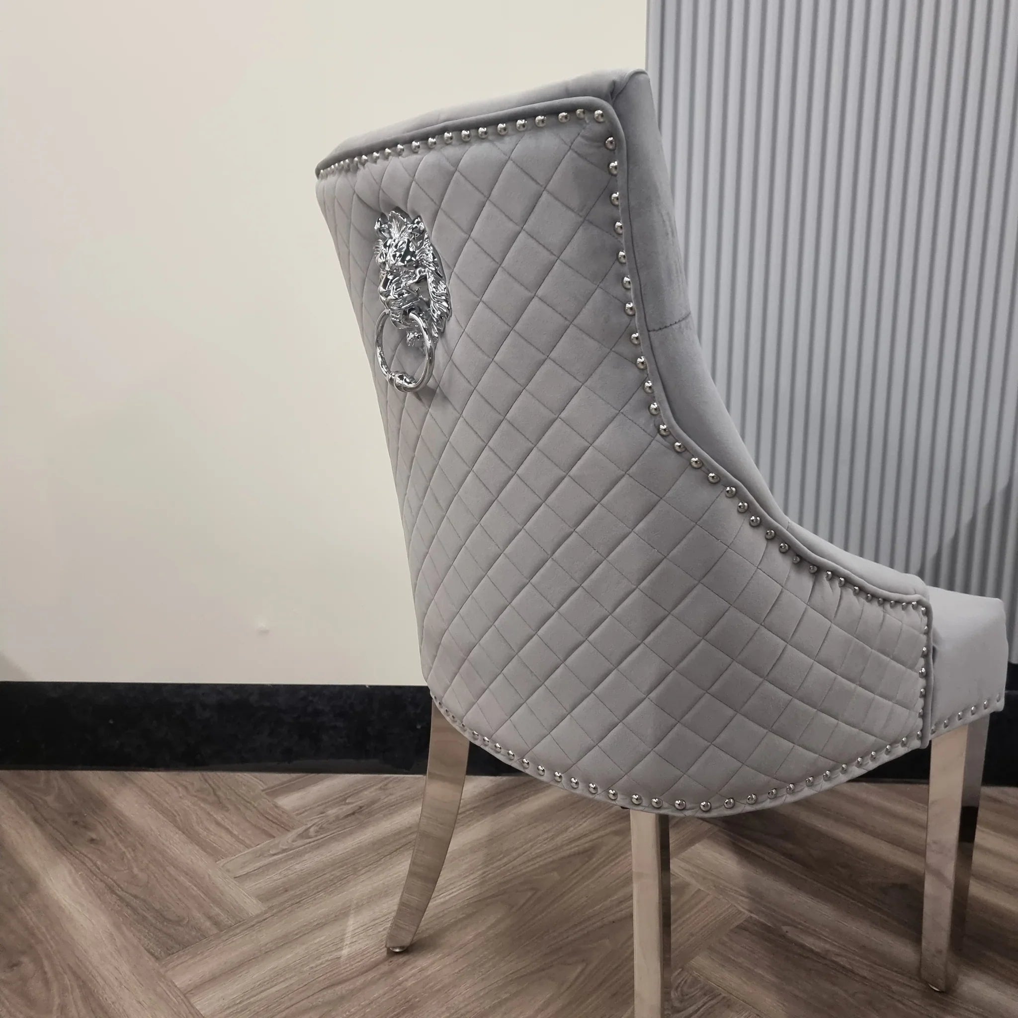 Back side view of Bentley velvet dining chair Solid Furniture UK showing lion knocker and chrome detailing