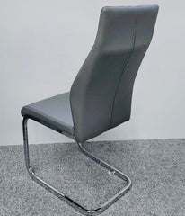 Berlin Grey Dining Chair UK front view featuring modern PU leather upholstery, padded seat, and chrome cantilever base for contemporary UK dining rooms from Solid Furniture UK