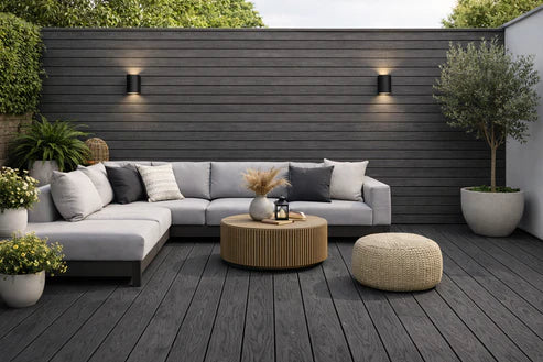 Black 290cm composite decking boards installed on a modern patio area for outdoor living by Solid Furniture UK