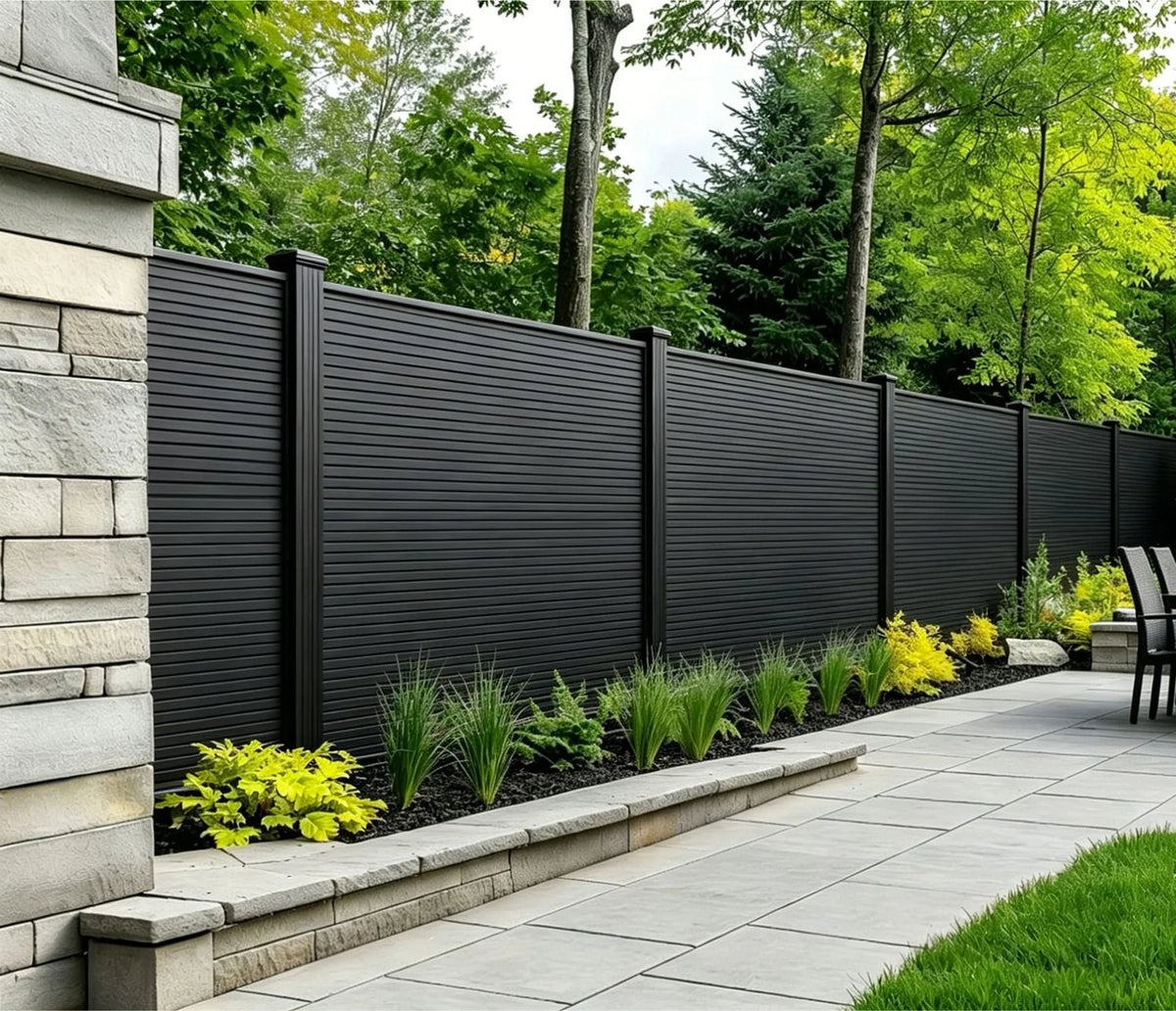 Black Composite Fence Panels by Solid Furniture UK installed in a stylish outdoor garden space