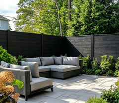 Black Composite Outdoor Fencing installed in a landscaped garden by Solid Furniture UK
