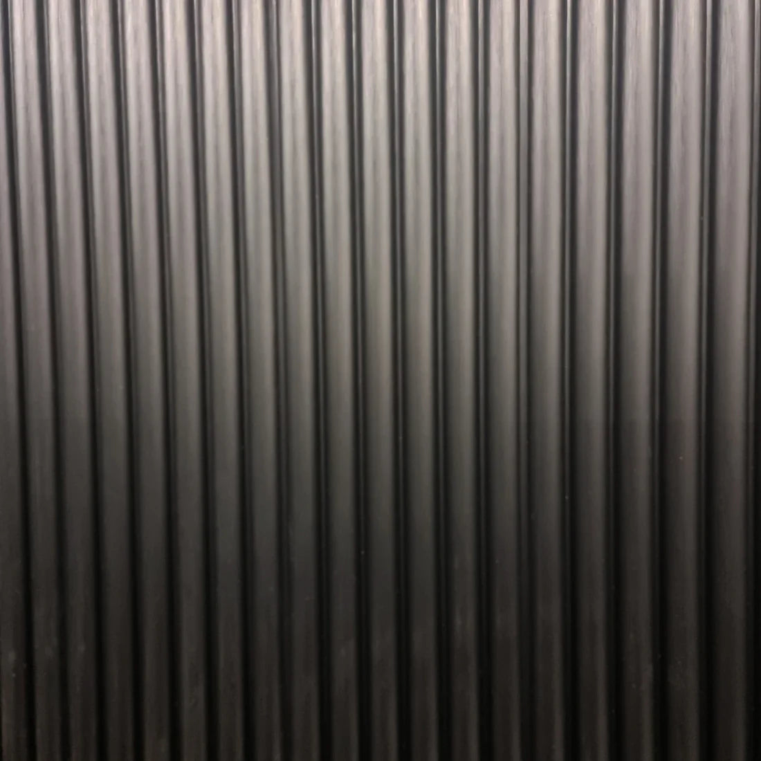 Main view of modern black fluted wall panels by Solid Furniture UK installed to create a stylish feature wall design