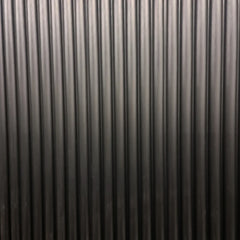 Main view of modern black fluted wall panels by Solid Furniture UK installed to create a stylish feature wall design