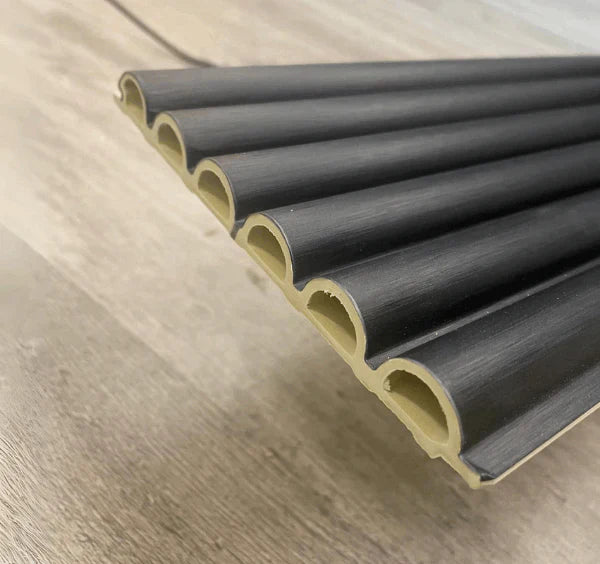 Close-up view of black WPC fluted wall panels from Solid Furniture UK showing detailed texture and premium decorative finish