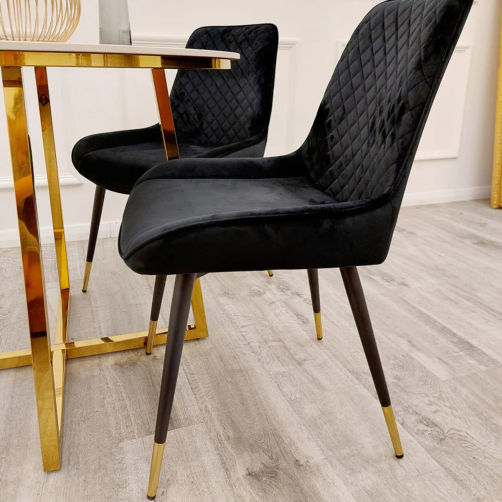 Side view of Black Luna dining chairs pair from Solid Furniture UK showing sleek silhouette and gold tipped legs