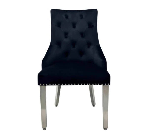 Black Majestic velvet dining chairs from Solid Furniture UK – main view with button tufted back and lion head handle design