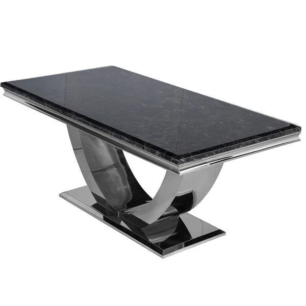 Black marble Arial dining table set with matching dining chairs in a modern interior.