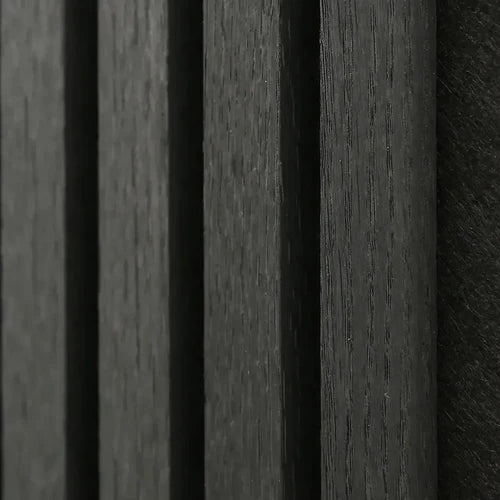 Close-up of Black Oak acoustic wall panel showing real wood veneer wrapped on three sides with premium finish and acoustic felt detail. solid furniture UK